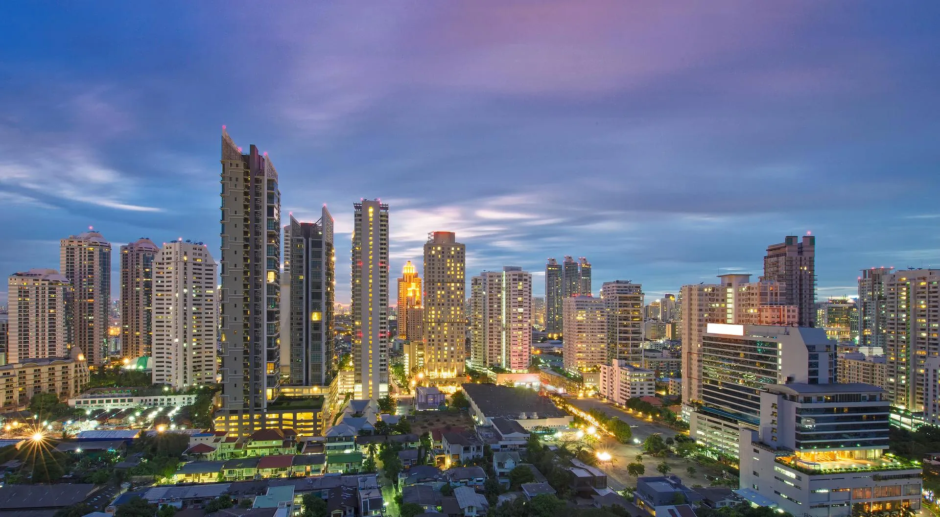 City skyline at evening with illuminated buildings